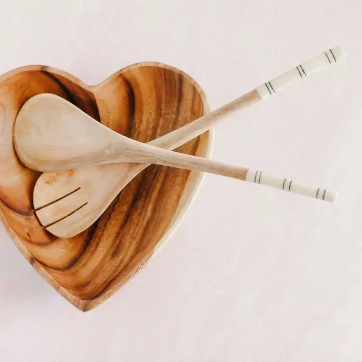 Wooden Kitchen Salad Serving Utensils placed inside a wooden heart shaped bowl