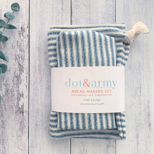 Packaged bread makers set with 'dot&army' label on a wooden surface with eucalyptus leaves.