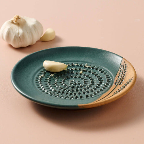 Ceramic dish with decorative patterns on a beige background