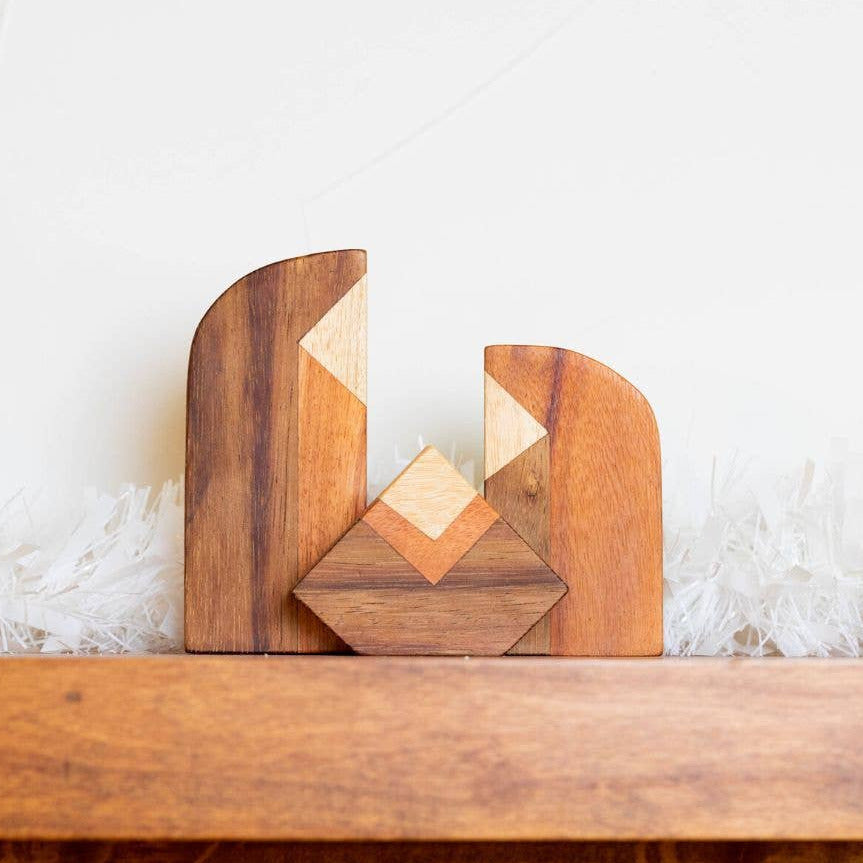 a set of 3 wooden figurines representing a nativity set of  joseph mary and jesus